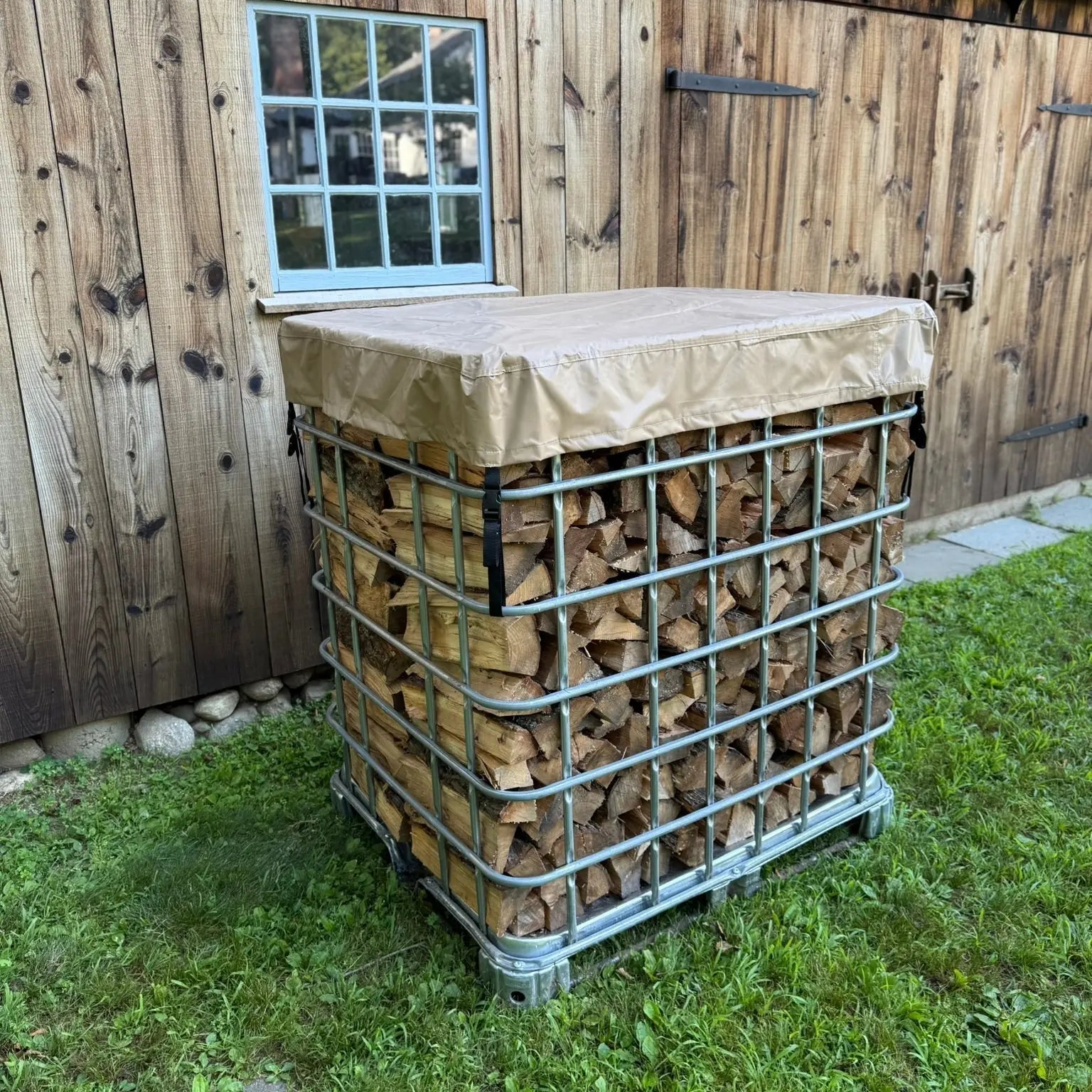IBC tote covered firewood stack by Cordwood Covers