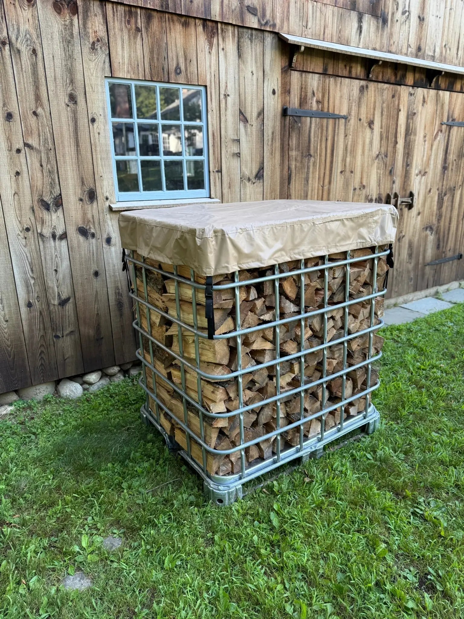 IBC tote covered firewood stack by Cordwood Covers